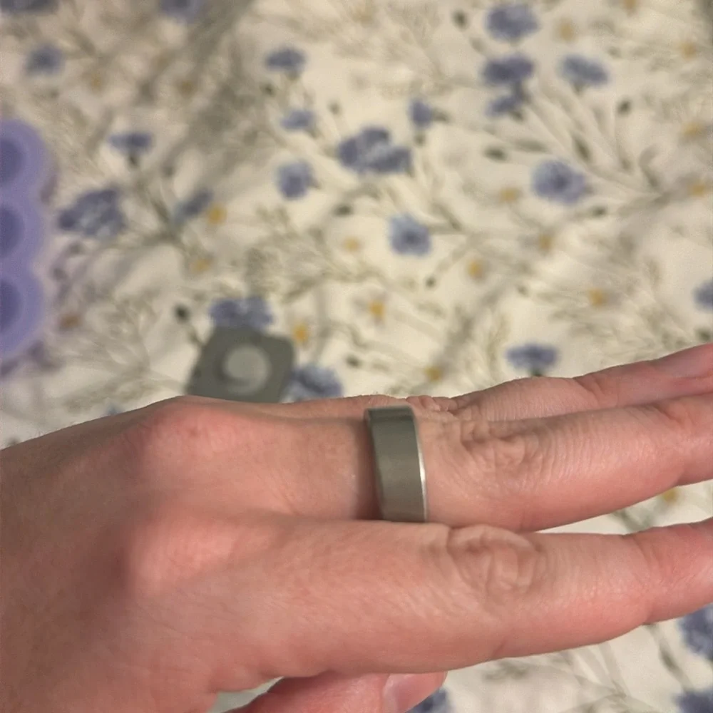 Oura ring 4 size 10 brushed silver finish. Charger included
